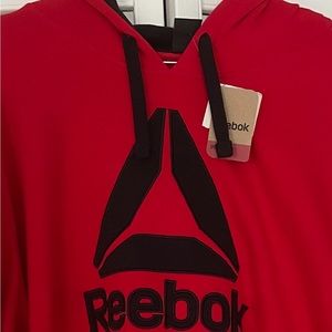 Red Reebok hoodie.
